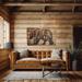 This is a large wood wall hanging featuring a bear and a forest scene. The artwork is hanging over a couch in a log cabin